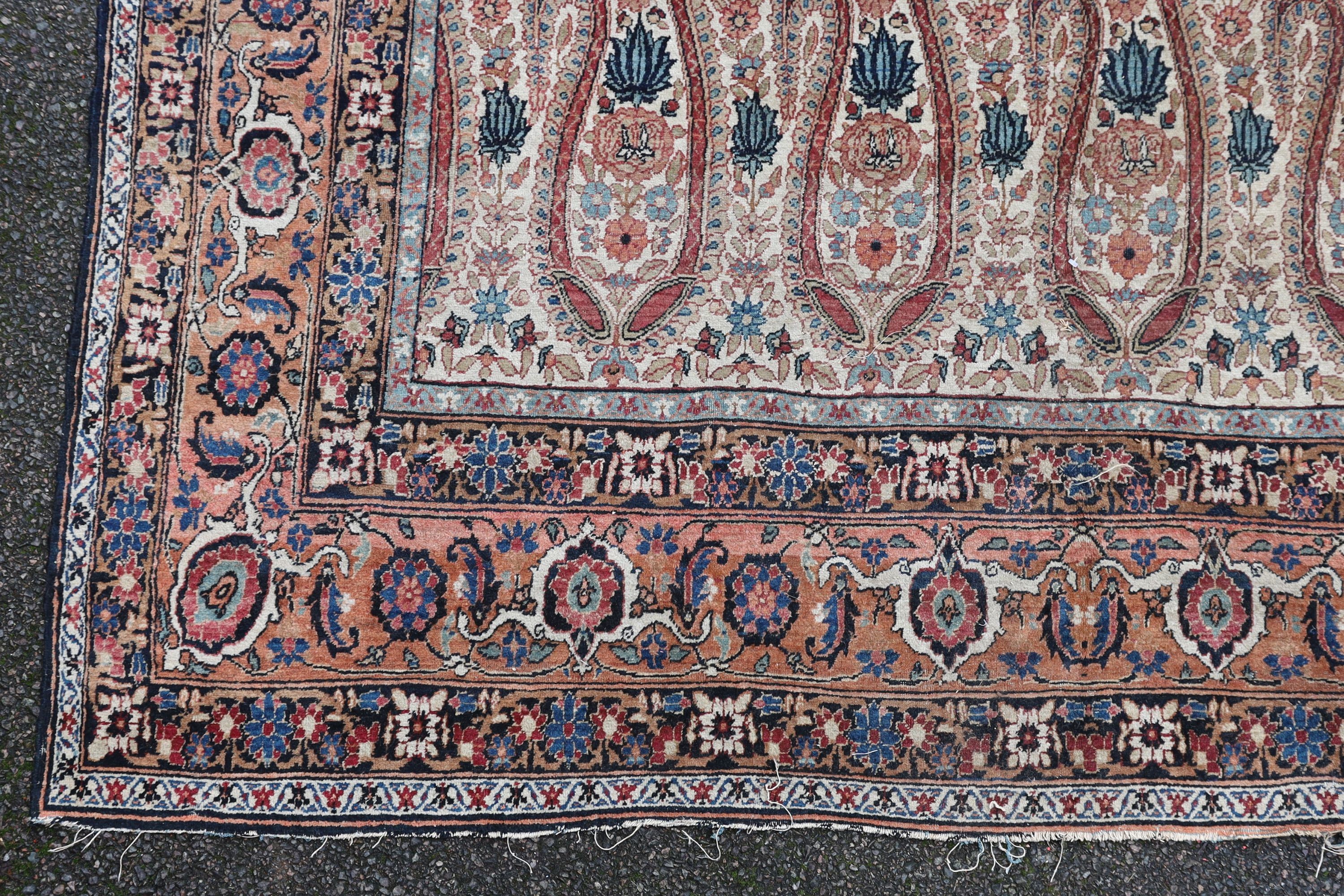 A Kerman rug ivory ground carpet, 360 x 218cm.
